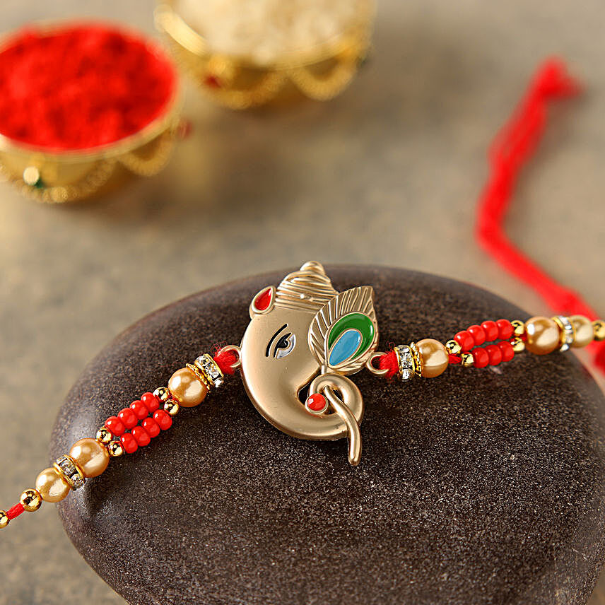 Alluring Rose Gold Ganesha Rakhi