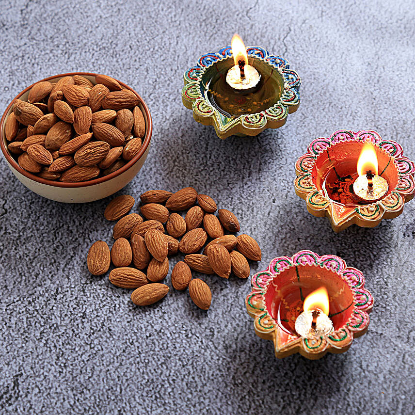 Floral Diyas With Greeting Card And Almonds