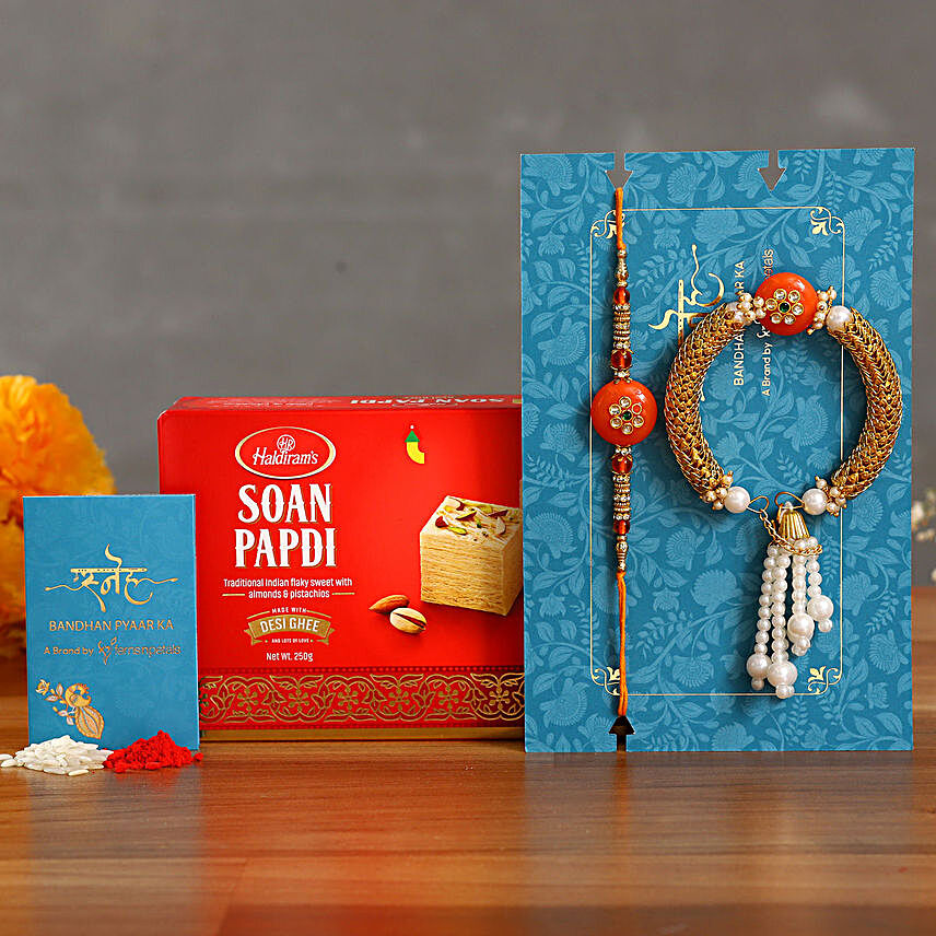 Orange Pearl And Lumba Rakhi Set With 250 Gms Soan Papdi