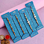 Pearl Studded And Mauli Rakhis Set Of 4 With 250 Gms Soan Papdi
