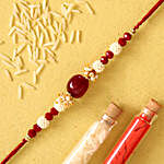 Red Beads Pearl Designer Rakhi With 100 Gms Almonds