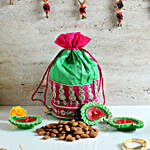 Pink & Green Potli of Dry Fruits & Terracotta Diyas