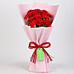 12 Red Carnations Bouquet in Pink Paper