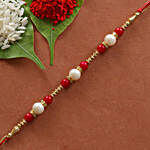 White & Red Pearl Rakhi With Dry Fruits