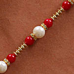 White & Red Pearl Rakhi With Dry Fruits