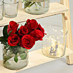 5 Cylindrical Red Roses On Wooden Ladder