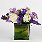 Fascinating White Roses & Purple Statice Flowers Glass Vase