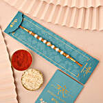 Sneh Pearl Rakhi with Cushion and Dry Fruits
