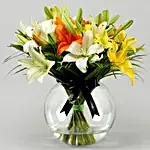 Mix Of Lilies In Fishbowl Vase