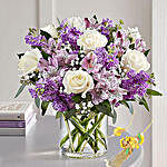 Purple And White Floral Bunch In Glass Vase With Rakhi