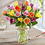Colourful Tulips In Glass Vase With Rakhi