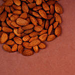 Yellow Crescent Shaped Lumba Rakhi Set With Healthy Almonds