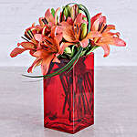 Sunset Lilies And Leriopi In A Red Square Vase