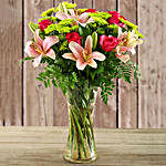 Pretty In Pink Lilies And Cerise Roses In A Vase