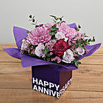 Purple Flowers Arrangement In Square Glass Vase