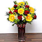 Bright Mixed Flowers In Red Vase