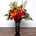 Roses and Asiatic Lilies In Vase With Chocolates