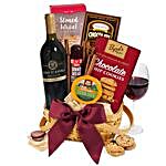 The Classy Basket Of Red Wine And Snacks